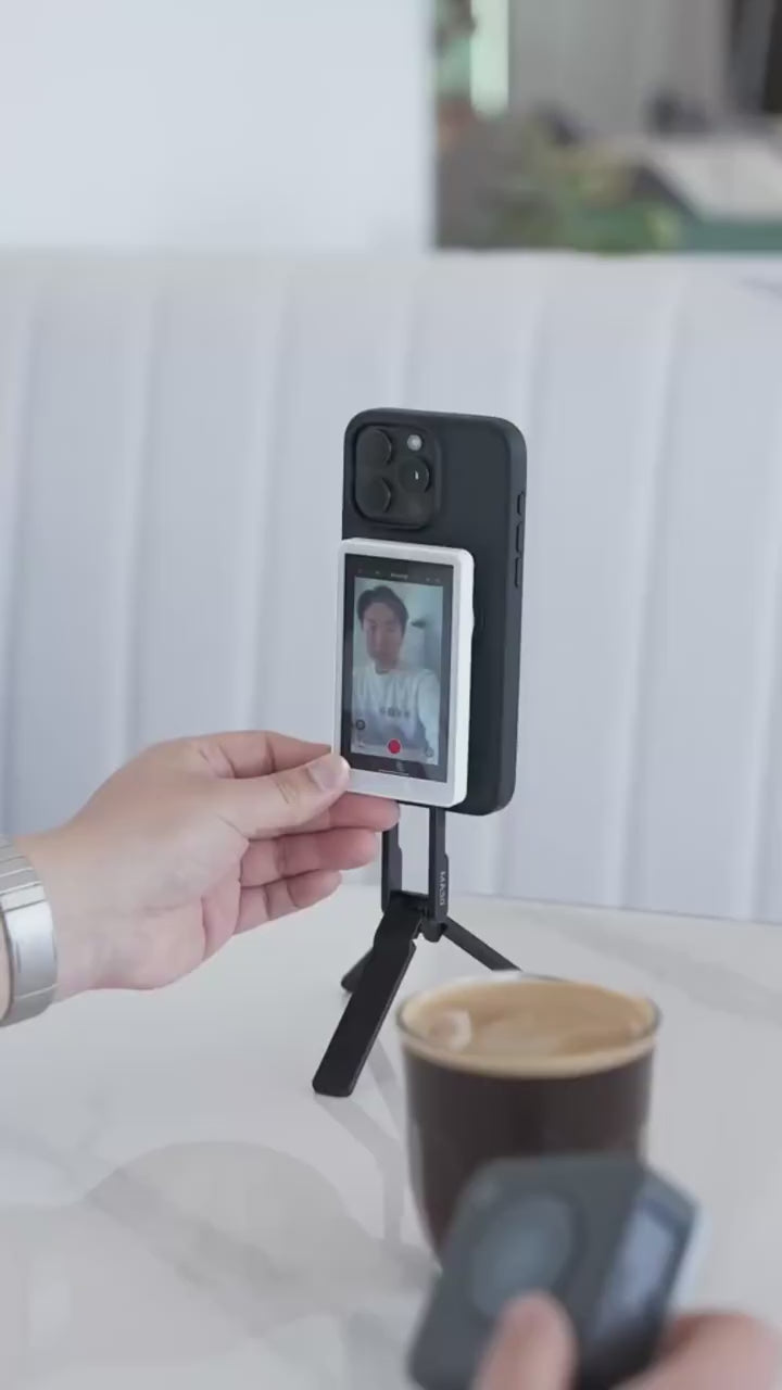 Load video: In this video, a confident male creator explains why the GlamSnap™ Mirror is a game-changer for anyone who creates content. Speaking directly to the camera, he highlights how cool, sleek, and simple the product is to use. He demonstrates how it lets you film with the back camera while still seeing yourself — no complicated setups, no second guessing. With casual confidence, he shows how fast it attaches and detaches, emphasizing the mirror’s practicality, portability, and quality. His energy is relaxed but persuasive, clearly impressing everyone around him with just how useful and stylish the device really is.